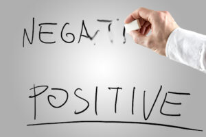 Man Erasing Negative Over Positive